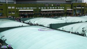 Regen in Wimbledon – ein Bild mit Tradition. Foto: dpa/Alastair Grant