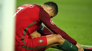 Portugals Ronaldo ist am Boden zerstört. Foto: dpa