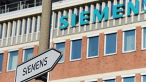 Bei dem Münchner Großkonzern Siemens drohen Werksschließungen und Entlassungen. Foto: AFP