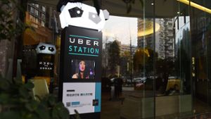 Eine Uber-Station im chinesischen Chengdu: Der Fahrdienstvermittler fusioniert mit seinem großen chinesischen Rivalen Didi Chuxing. Foto: AFP